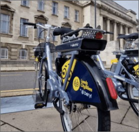Photograph of a branded electric bike outside the Parkinson building in Leeds. Leeds City Council: Leeds City Bikes. Image credit: @Leeds.Life