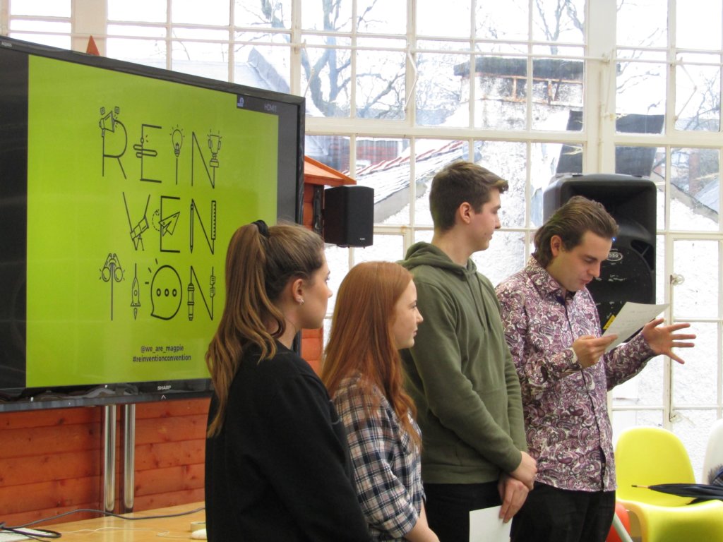 students giving a presentation at reinvention convention