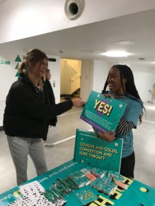 Faith playing an interactive game with another student.